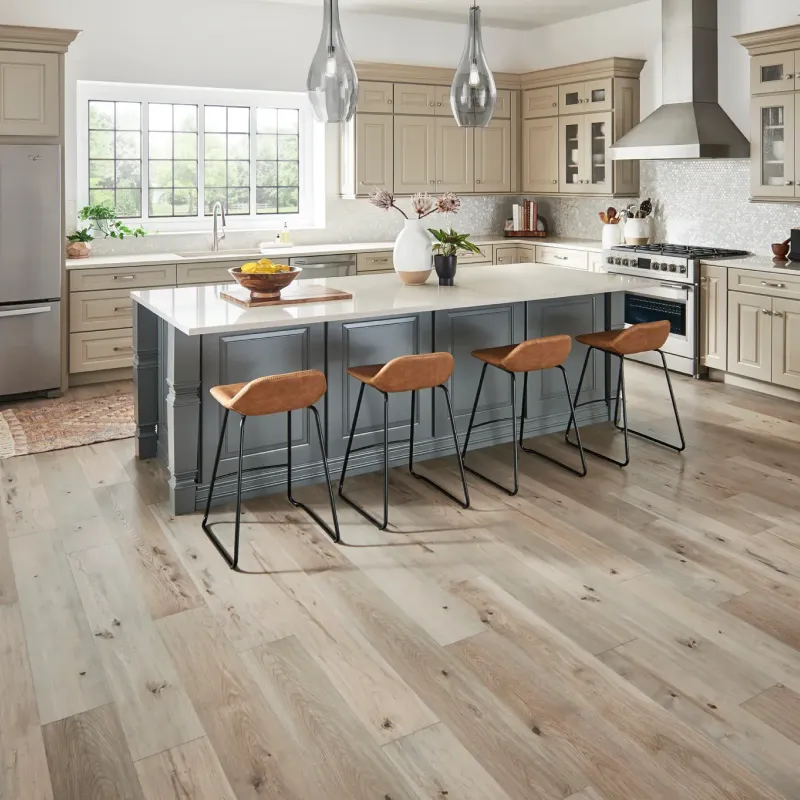 Laminate flooing in modern kitchen with two tone cabinets